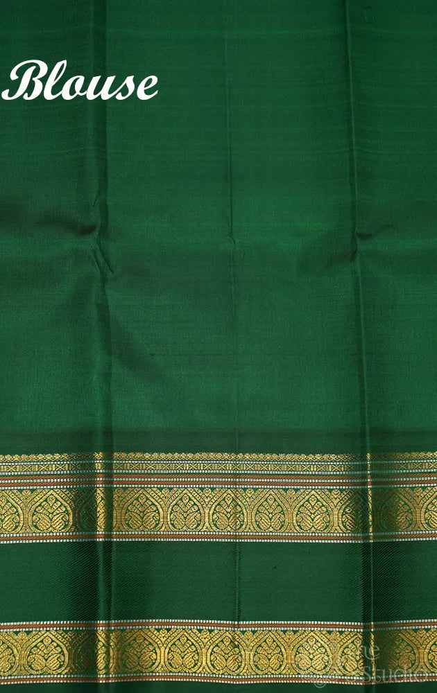 Red checked kanchi pattu saree with green rettaipet border