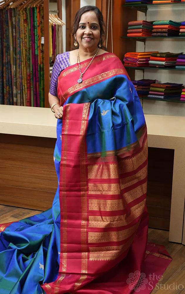 Peacock blue kanchipuram silk saree with korvai rettaipet border