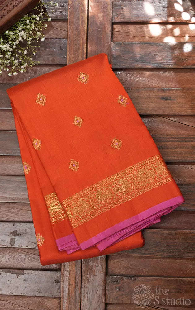 Orange kanchipuram silk saree with meena buttas