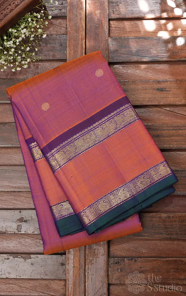 Rust kanchi silk saree with violet pallu