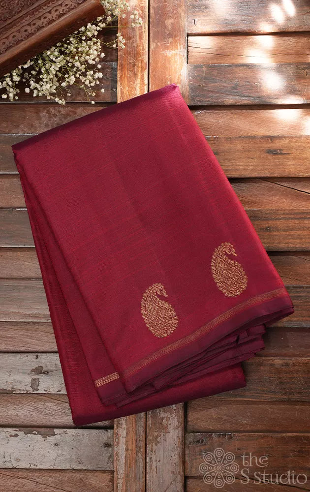 Maroon kanchi silk saree with mango motifs along the border