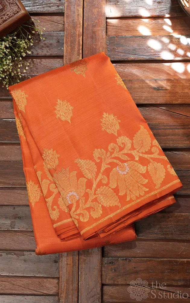 Orange Kanchipuram silk saree with floral weave border