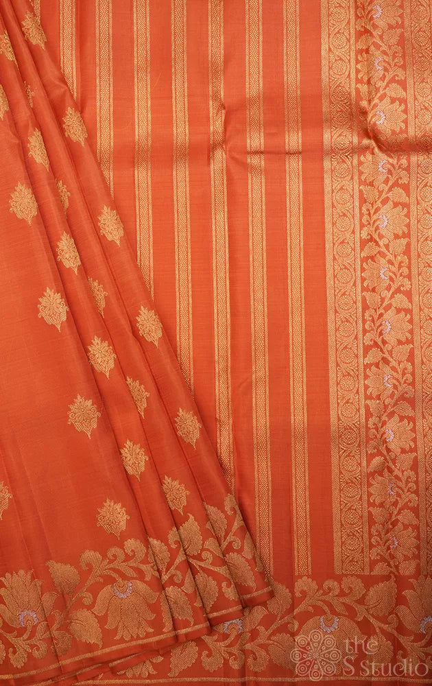 Orange Kanchipuram silk saree with floral weave border