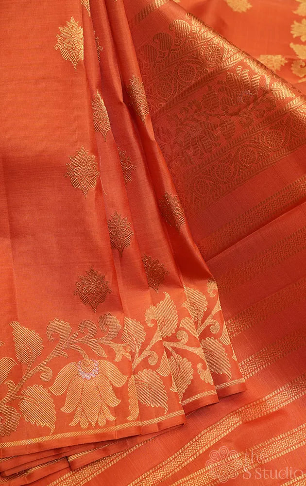 Orange Kanchipuram silk saree with floral weave border