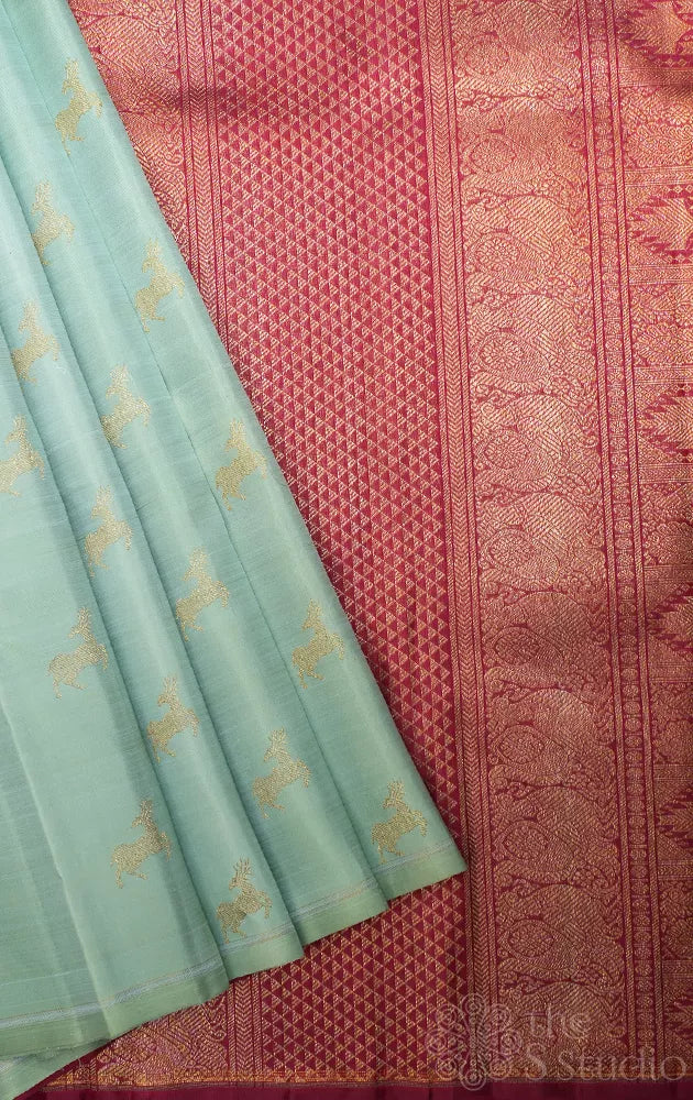 Elaichi green Kanjivaram silk saree with deer zari buttas and contrast pallu
