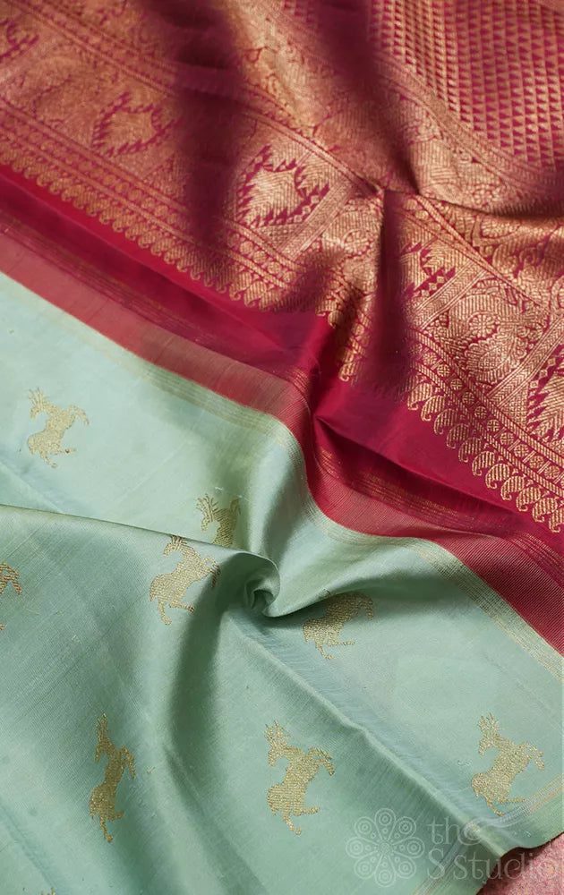 Elaichi green Kanjivaram silk saree with deer zari buttas and contrast pallu