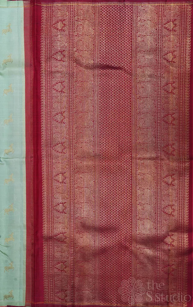 Elaichi green Kanjivaram silk saree with deer zari buttas and contrast pallu