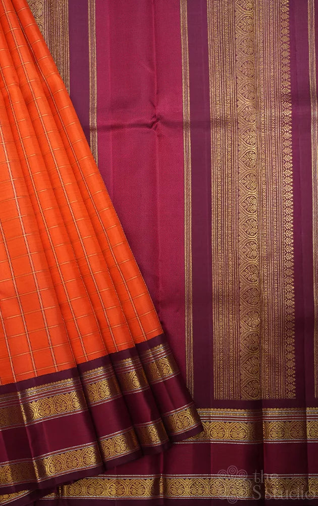 Orange kanjivaram silk saree with zari checks and korvai brown border