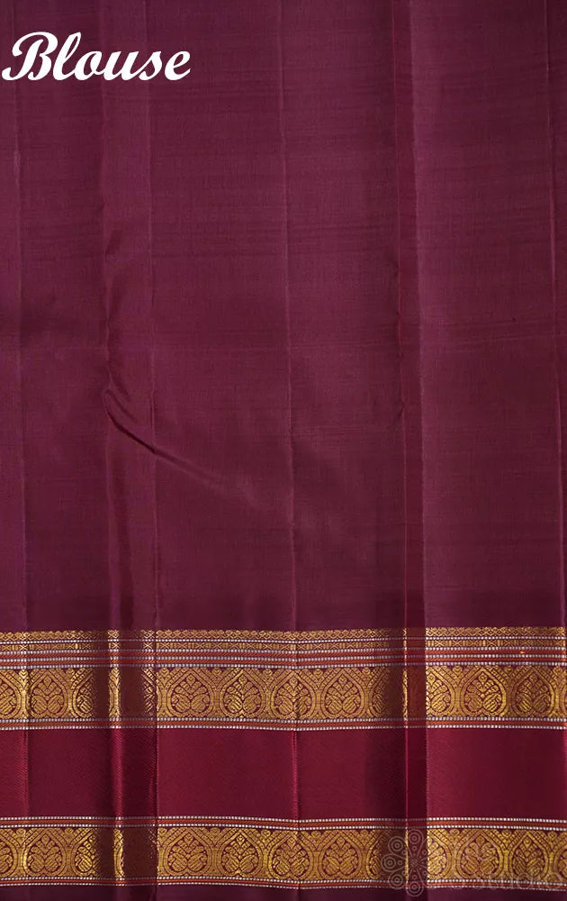 Orange kanjivaram silk saree with zari checks and korvai brown border
