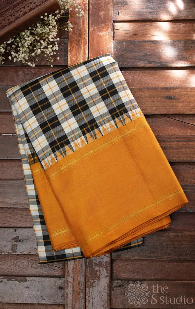 Black and white checked kanchi silk saree with korvai mustard border