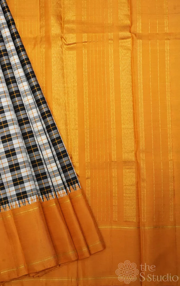 Black and white checked kanchi silk saree with korvai mustard border