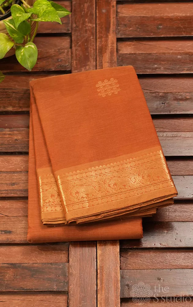 Rust handloom kanchi cotton saree with zari woven border