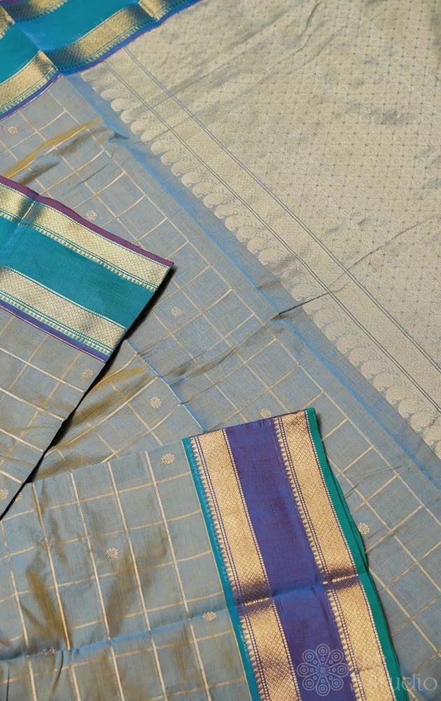 Powder blue zari checked kanchi cotton saree with rettaipet border