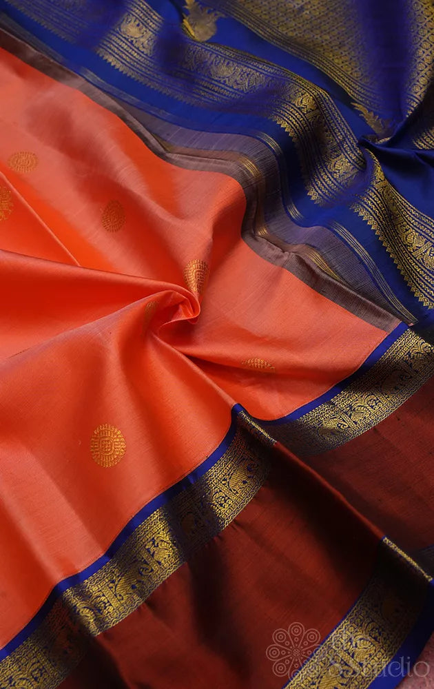 Orangish peach kanjivaram silk saree with korvai rettaipet border