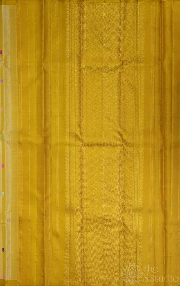 Golden beige kanjivaram silk saree with thread buttas and a zari pallu