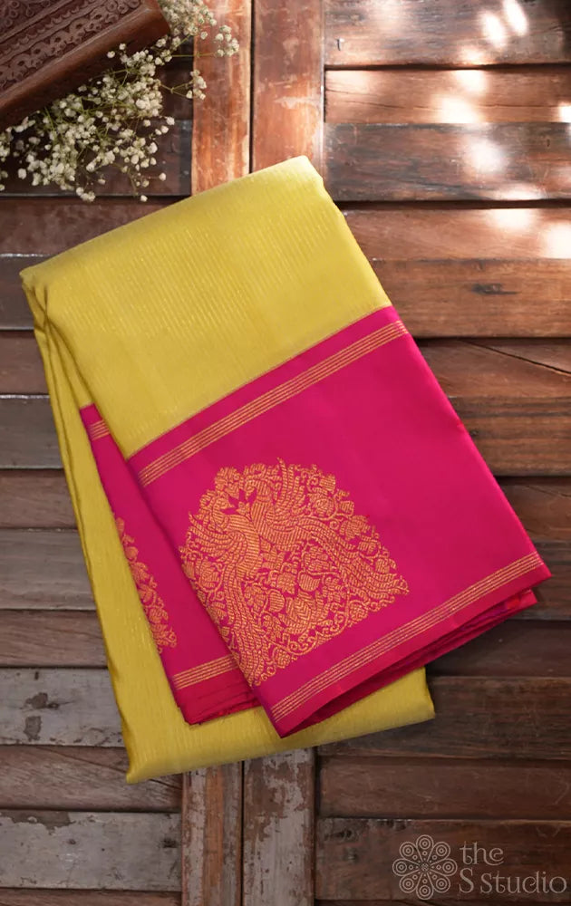 Light elachi green kanchipuram silk saree with ranipink border