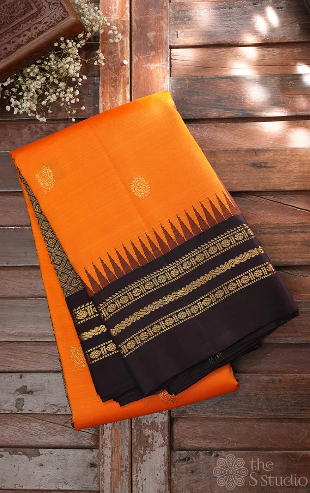 Orange kanjivaram silk saree with korvai brown border