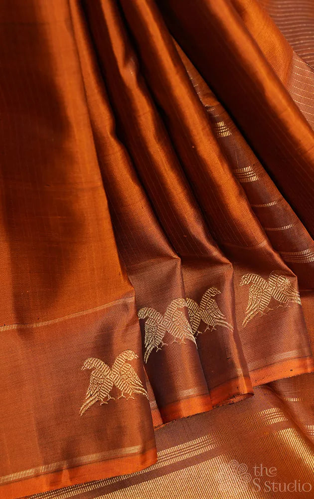 Honey rust kanjivaram silk saree with vertical zari lines