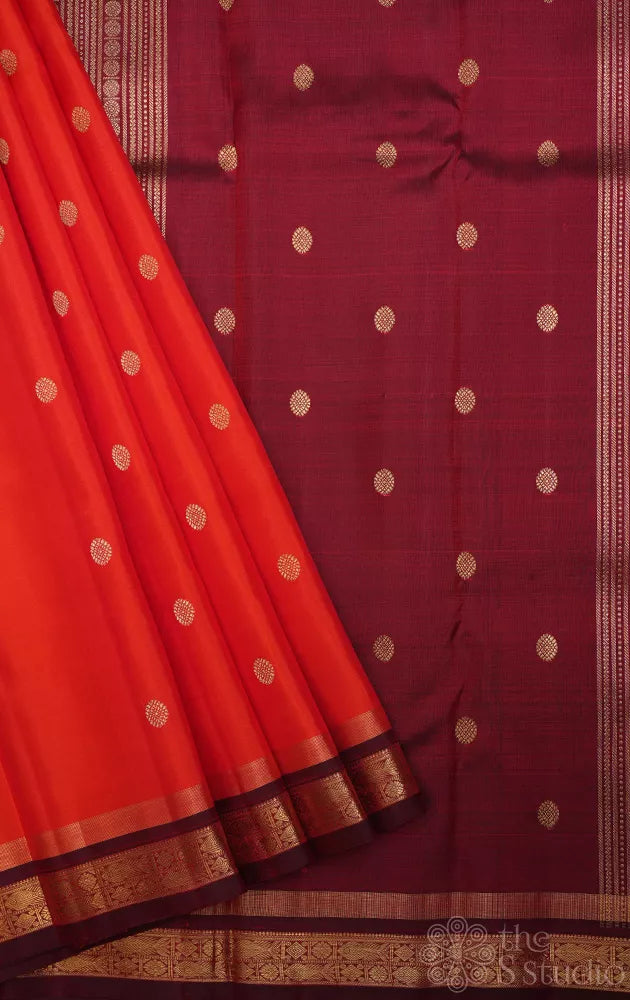 Bright orange kanjivaram silk saree with brown border