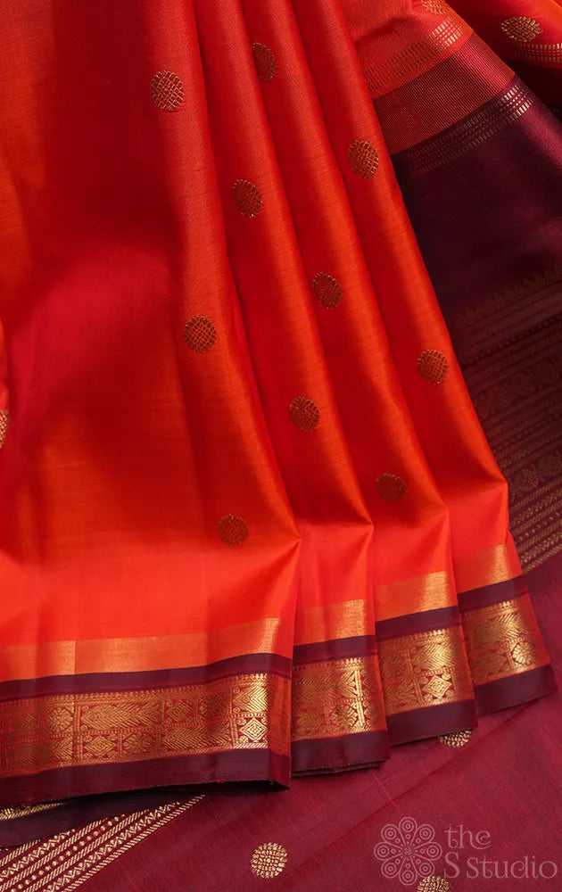 Bright orange kanjivaram silk saree with brown border
