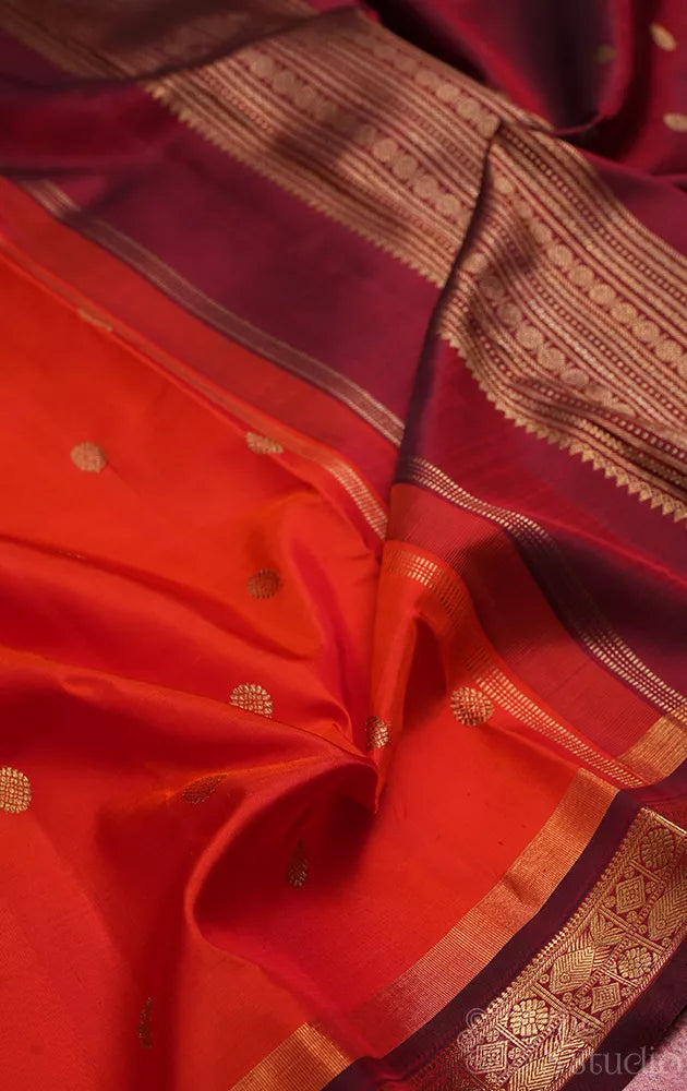 Bright orange kanjivaram silk saree with brown border