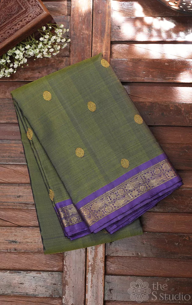Olive green kanchi pattu saree with lavendar border and pallu