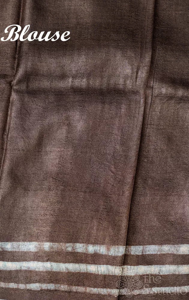 Dark brown tussar silk saree with light blue batik prints