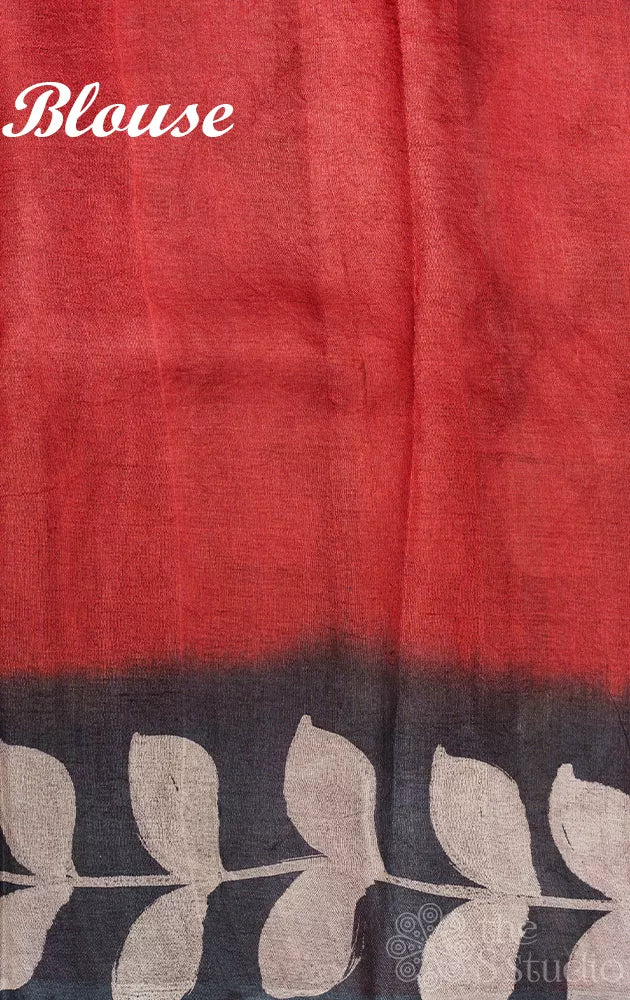 Black tussar silk saree with red border and batik prints