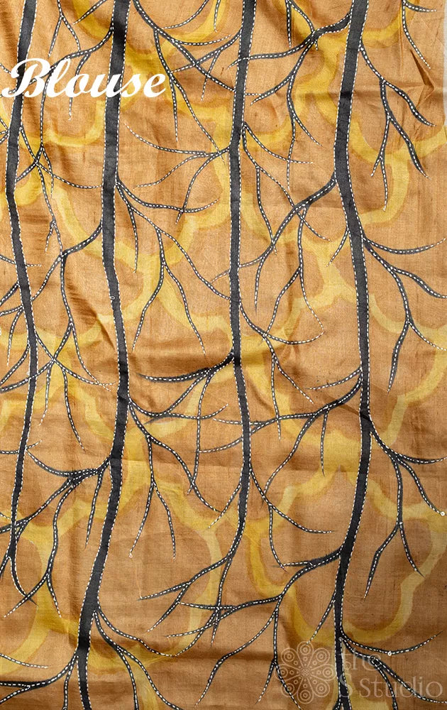 Brown and mustard hand embroidered tussar silk saree with hand batik prints