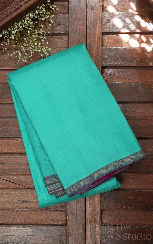 Sea green colour plain kanchi silk saree with contrast pallu