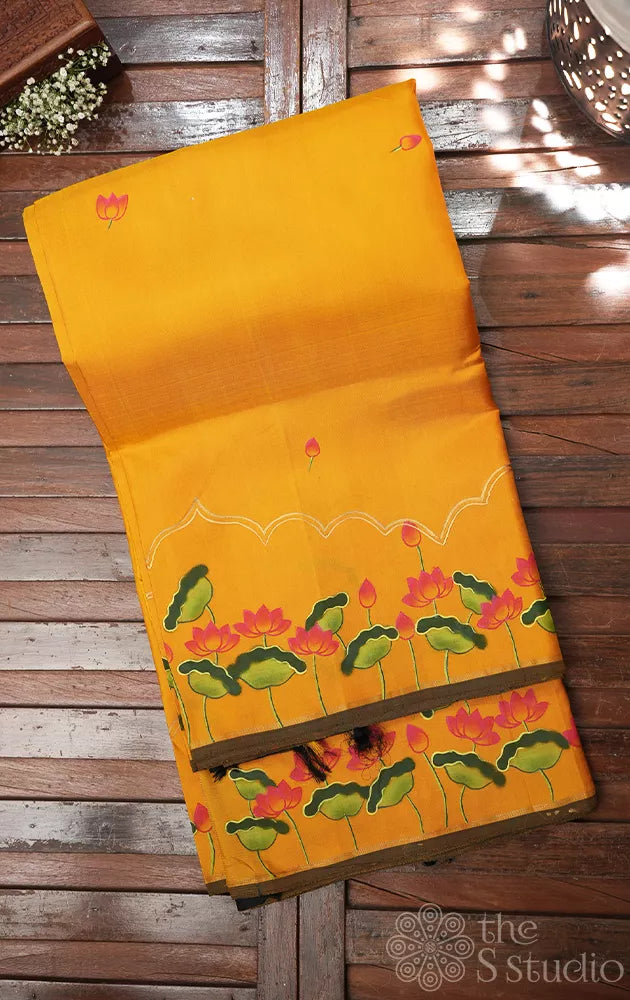 Mustard kanchipuram silk saree with hand painted pichwai and a black pallu
