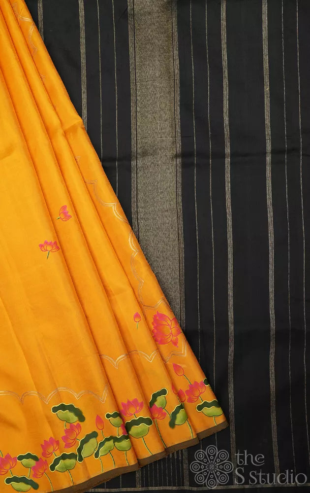 Mustard kanchipuram silk saree with hand painted pichwai and a black pallu