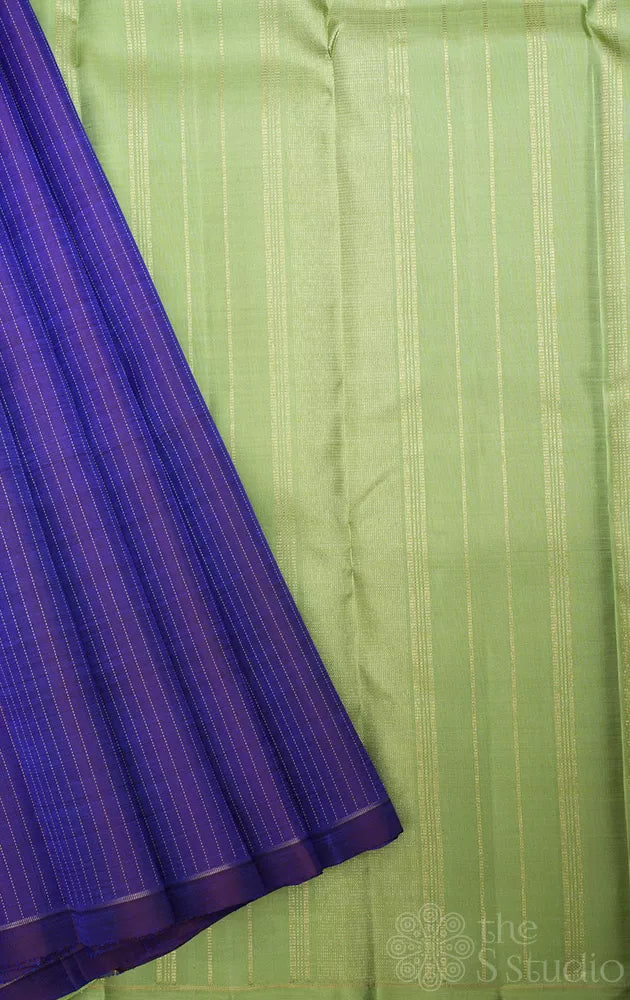 Violet borderless Kanchipuram silk saree with contrast elaichi green pallu