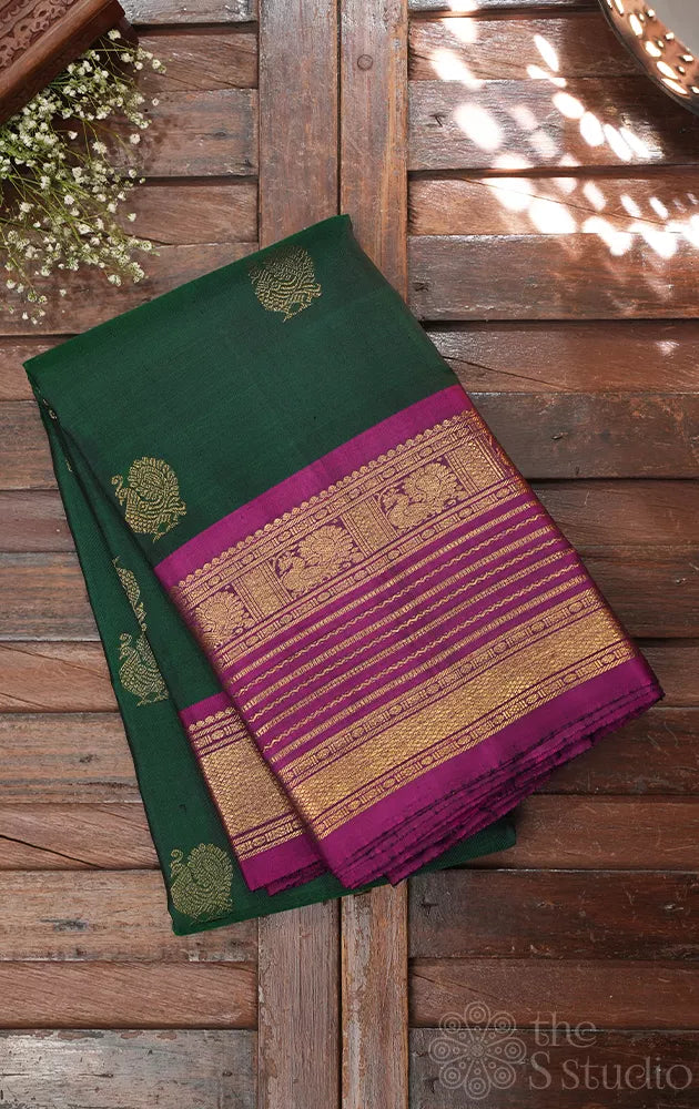 Bottle green kanjivaram silk saree with magenta border
