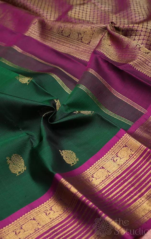 Bottle green kanjivaram silk saree with magenta border