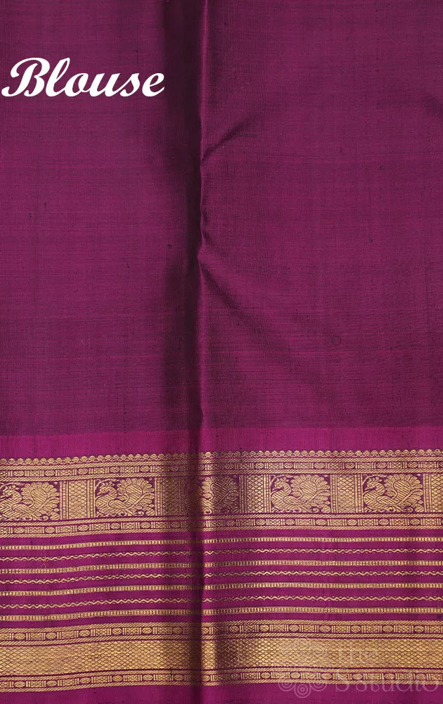 Bottle green kanjivaram silk saree with magenta border