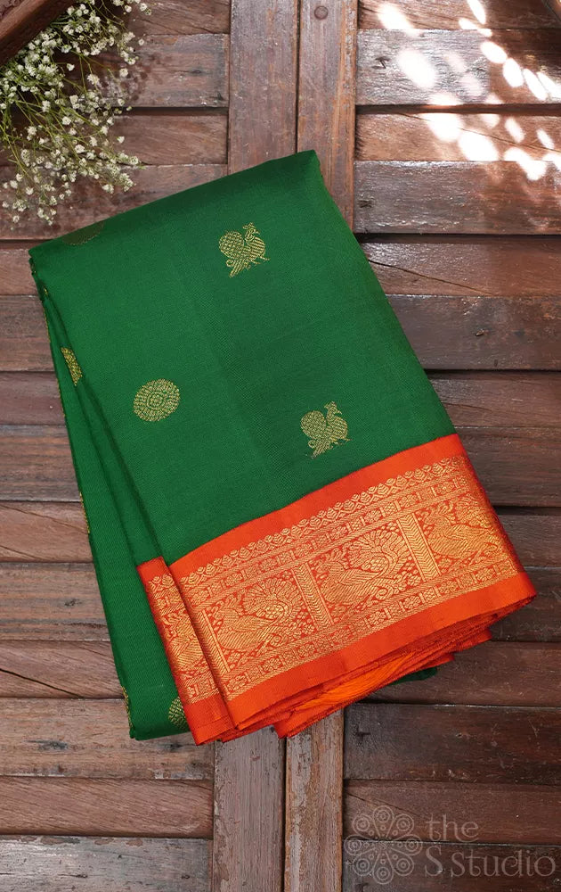 Leaf green kanchi pattu saree with korvai orange border