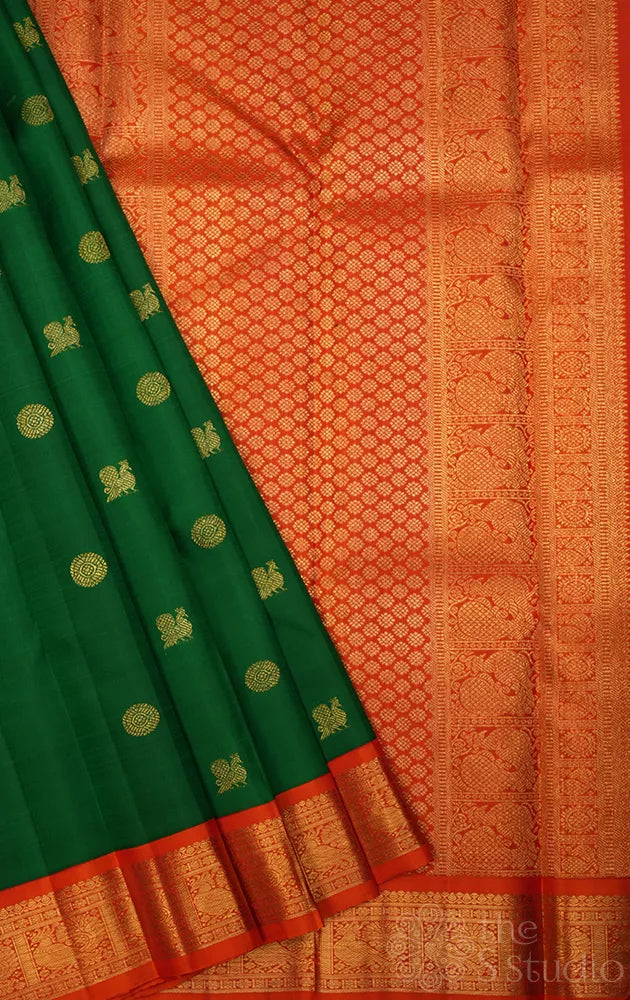 Leaf green kanchi pattu saree with korvai orange border