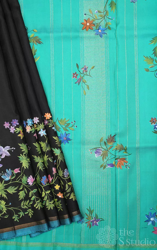 Black kanchipuram silk saree with floral hand painting and a sea green pallu