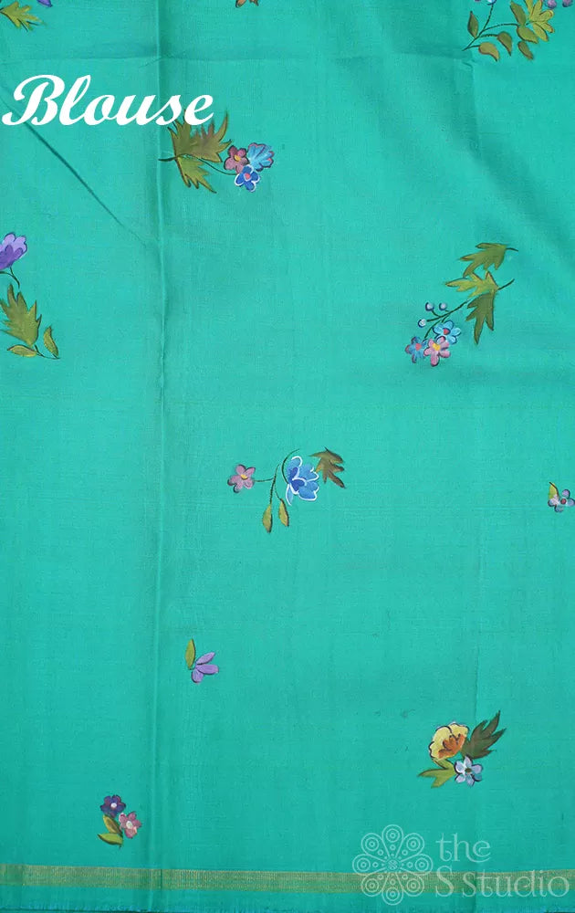 Black kanchipuram silk saree with floral hand painting and a sea green pallu