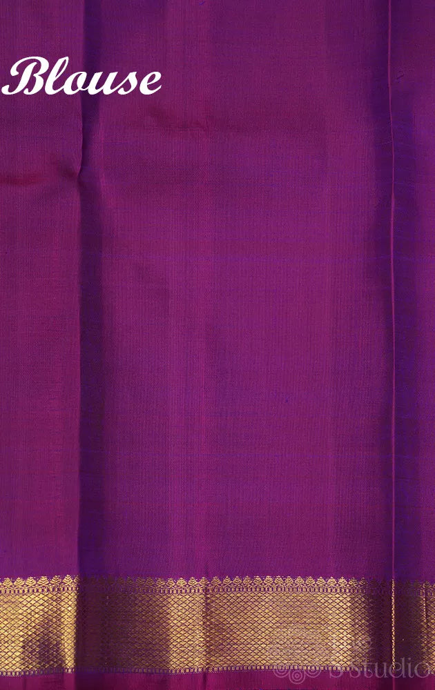 Violet kanchipuram silk saree with small purple getti zari border