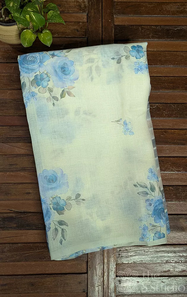Off white linen saree with blue floral prints 