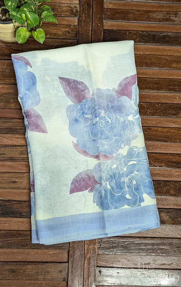 Off white linen saree with powder blue floral prints