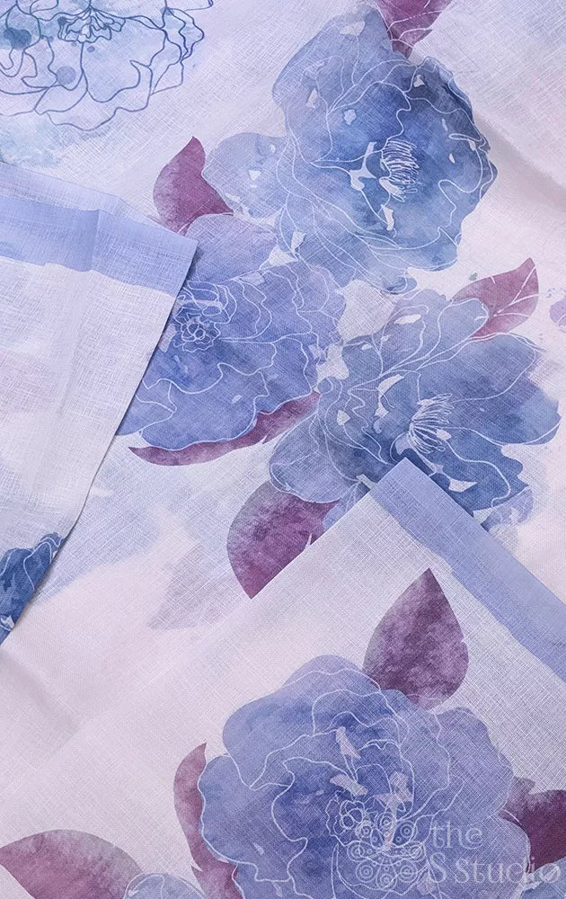 Off white linen saree with powder blue floral prints