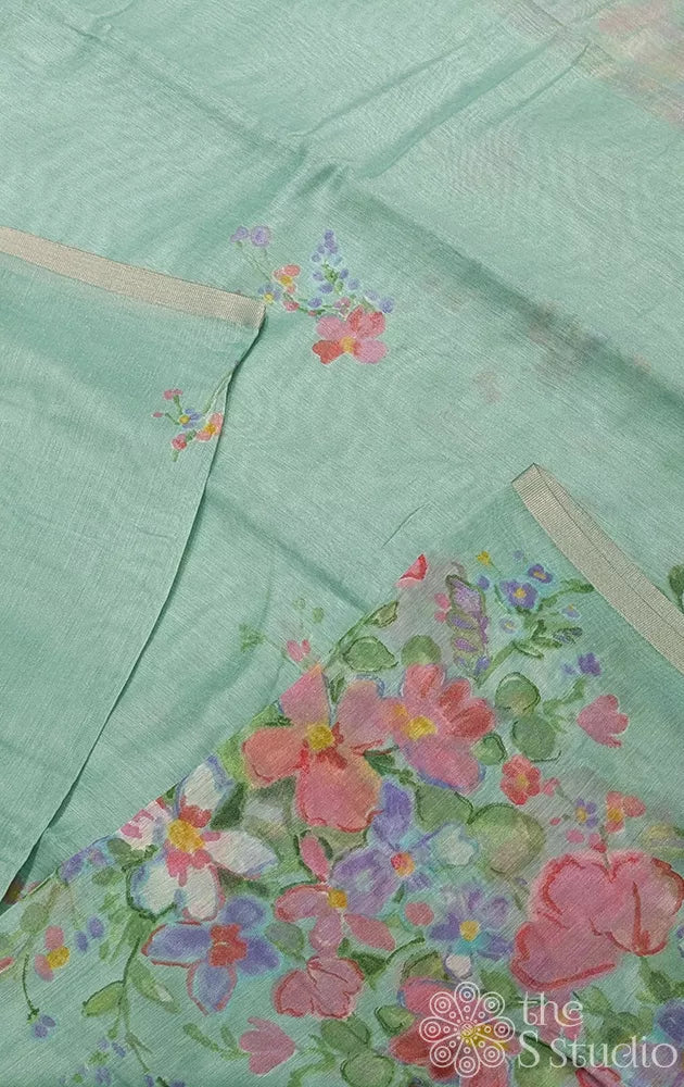 Light green linen saree with peach floral prints