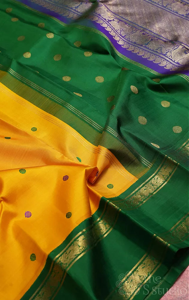 Mustard korvai kanjivaram silk saree with peacock blue and green border