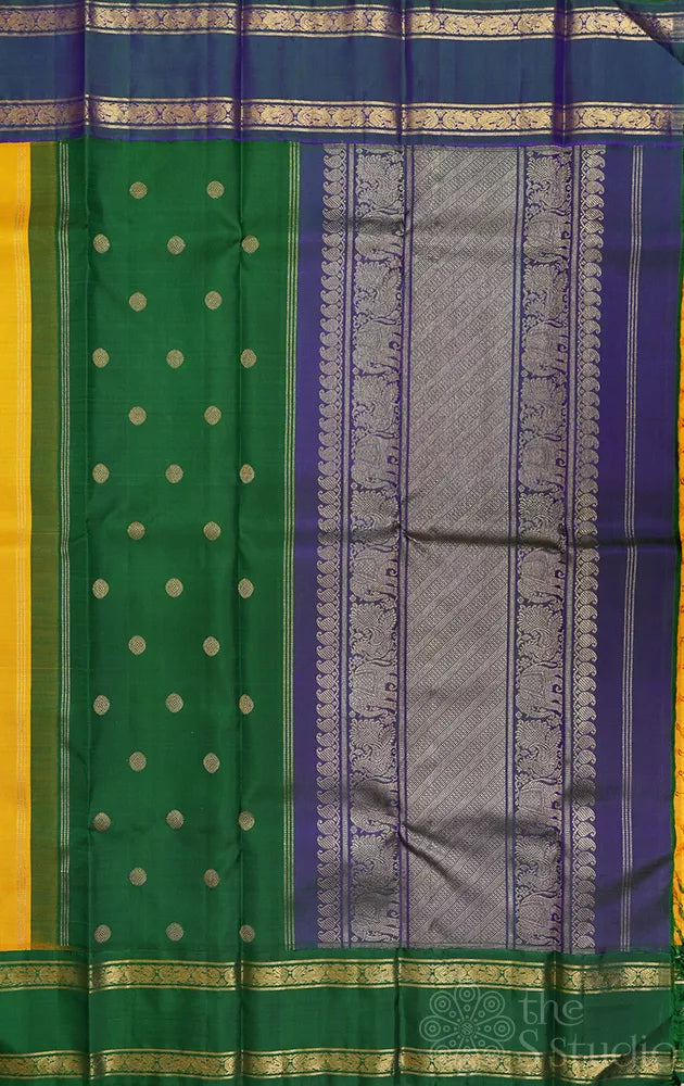 Mustard korvai kanjivaram silk saree with peacock blue and green border
