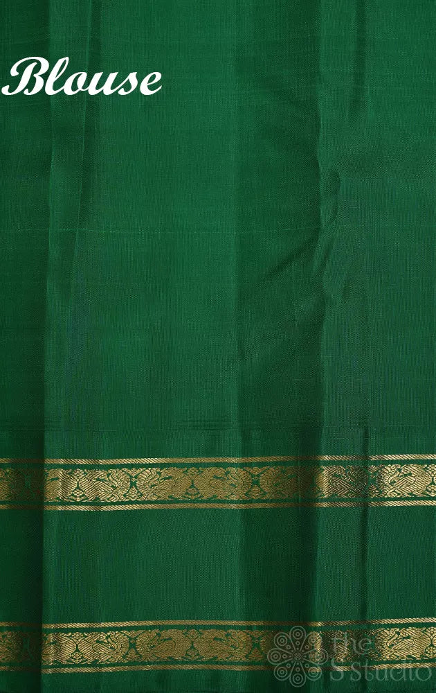 Orange korvai kanchi pattu saree with peacock blue and green border
