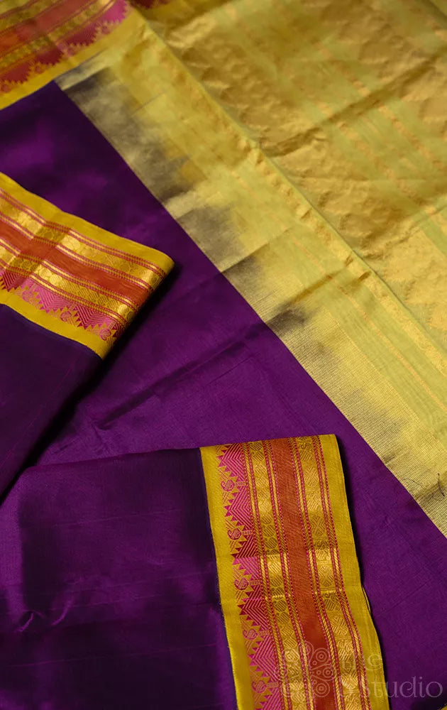 Violet silk cotton saree with yellow korvai border