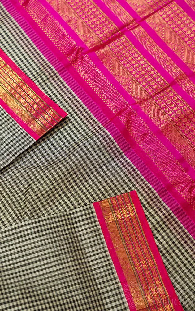 Black and white checked cotton silk saree with rani pink korvai border